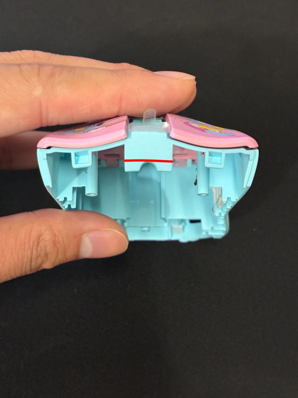 Second red-marked area to trim on the top shell